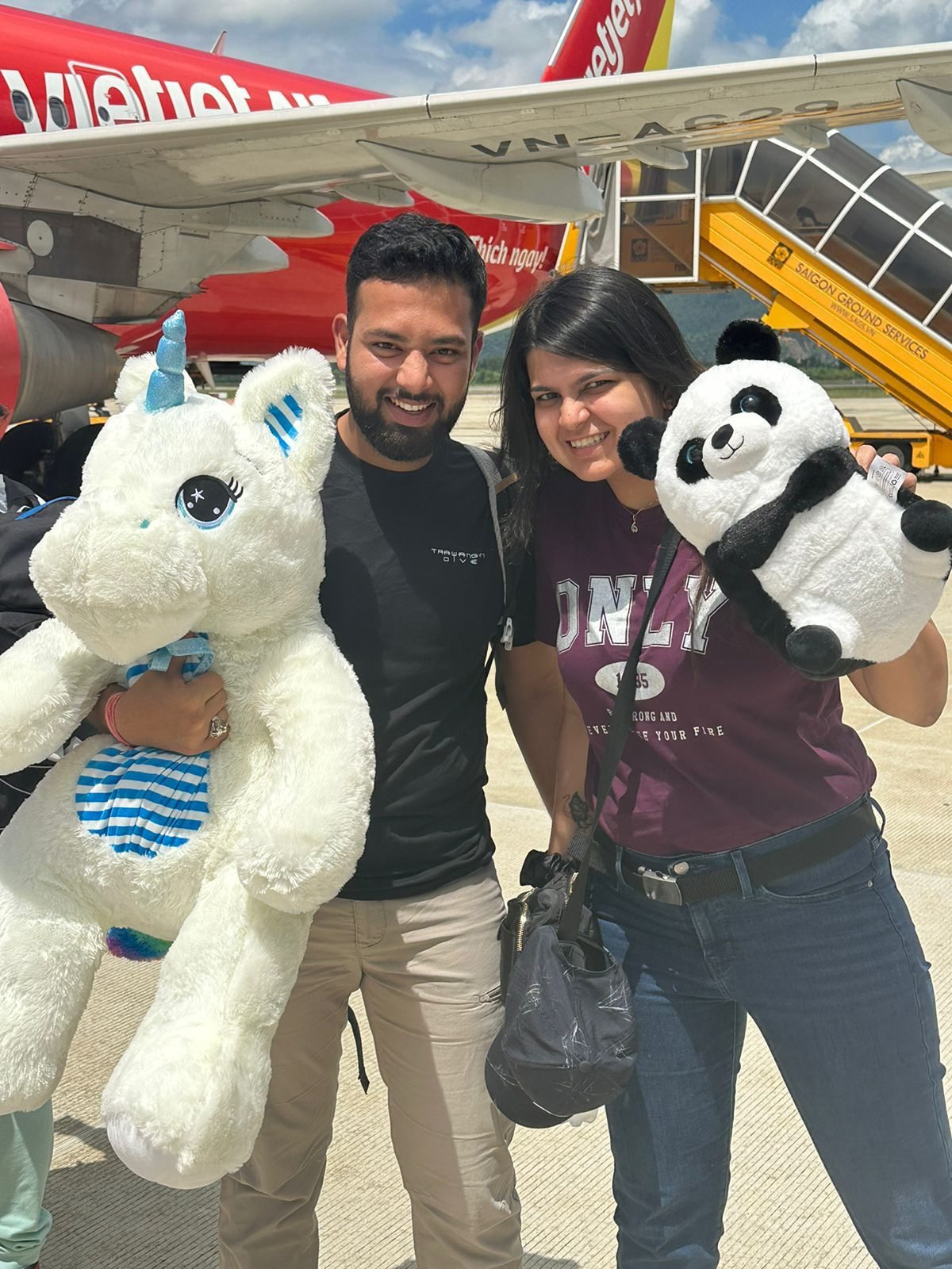 Travellers smiling before a flight